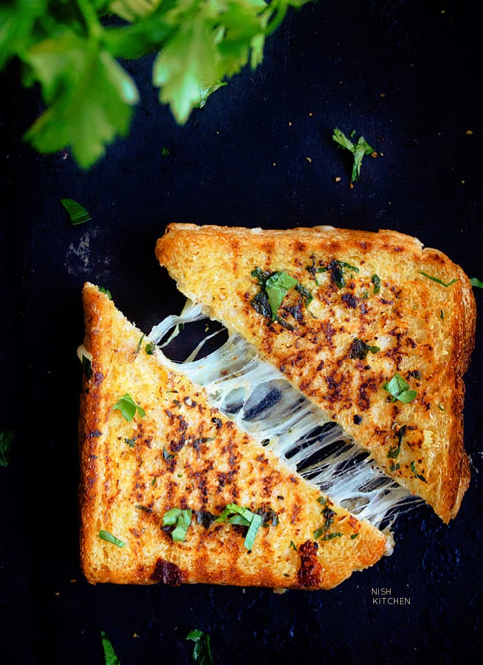 https://nishkitchen.com/wp-content/uploads/2021/07/Garlic-Bread-Grilled-Cheese-1B.jpg